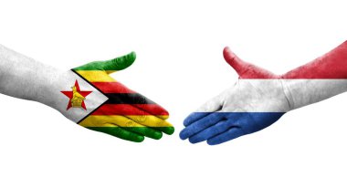 Hollanda ve Zimbabwe bayrakları arasında el sıkışma, izole şeffaf görüntü.