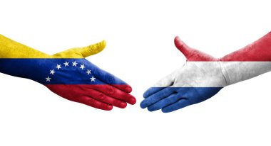 Hollanda ve Venezuela bayrakları arasındaki el sıkışma ellere boyanmış, izole şeffaf görüntü.
