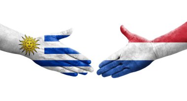 Hollanda ve Uruguay bayrakları arasındaki el sıkışma, izole şeffaf görüntü.