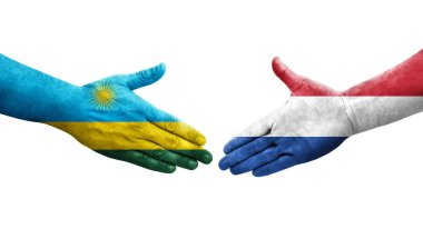 Hollanda ve Ruanda bayrakları arasındaki el sıkışma ellerinde resmedilmiş şeffaf görüntü.