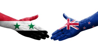 Yeni Zelanda ve Suriye bayrakları arasında el sıkışma, izole şeffaf görüntü.