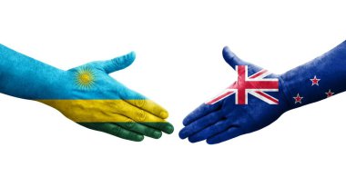 Yeni Zelanda ve Ruanda bayrakları arasındaki el sıkışma ellerinde izole şeffaf görüntü.