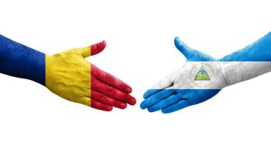 Nikaragua ve Romanya bayrakları arasındaki el sıkışma, izole şeffaf görüntü.