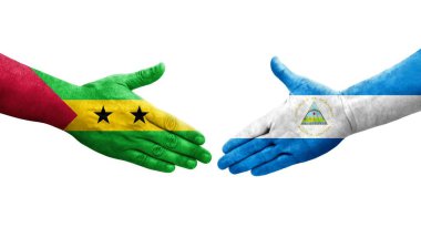 Nikaragua ve Sao Tome ve Principe bayrakları arasındaki el sıkışma, izole şeffaf görüntü.