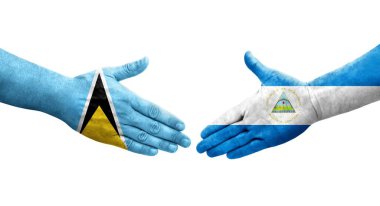 Nikaragua ve Saint Lucia bayrakları arasındaki el sıkışma..
