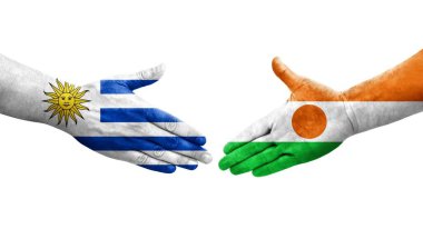 Nijer ve Uruguay bayrakları arasındaki el sıkışma, izole şeffaf görüntü.