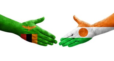 Ellerinde Nijer ve Zambiya bayrakları arasında el sıkışma, izole saydam görüntü.