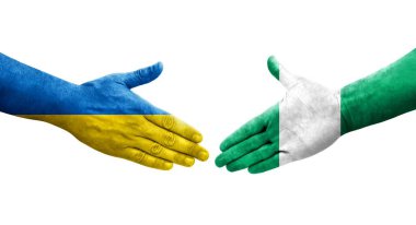 Ellerinde Nijerya ve Ukrayna bayrakları arasında el sıkışma, izole şeffaf görüntü.