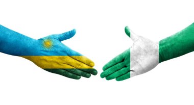 Nijerya ve Ruanda bayrakları arasındaki el sıkışma ellerinde izole şeffaf görüntü.