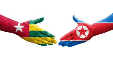 Kuzey Kore ve Togo bayrakları arasındaki el sıkışma..