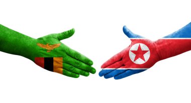 Kuzey Kore ve Zambiya bayrakları arasında el sıkışma, izole şeffaf görüntü.
