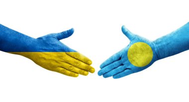Palau ve Ukrayna bayrakları arasındaki el sıkışma, izole şeffaf görüntü.