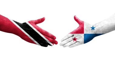 Panama ve Trinidad Tobago bayrakları arasındaki tokalaşma elleri boyalı, izole şeffaf görüntü.