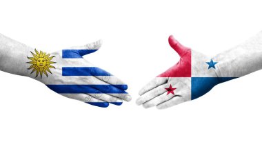 Panama ve Uruguay bayrakları arasındaki tokalaşma elleri boyalı, izole şeffaf görüntü.