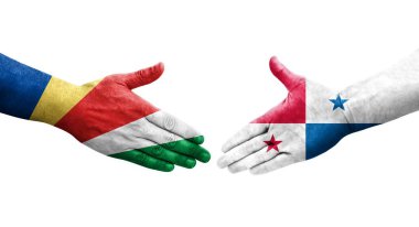 Panama ve Seyşeller arasındaki el sıkışma ellerinde boyanmış bayraklar, izole şeffaf görüntü.