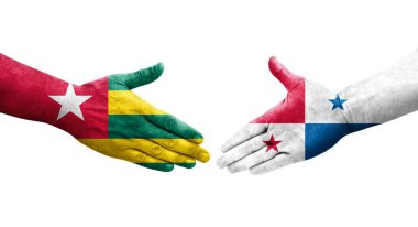 Ellerde Panama ve Togo bayrakları arasında el sıkışma, izole şeffaf görüntü.