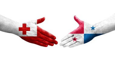 Panama ve Tonga bayrakları arasındaki tokalaşma elleri boyalı, izole şeffaf görüntü.