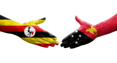 Papua Yeni Gine ile Uganda bayrakları arasındaki el sıkışma, izole şeffaf görüntü.