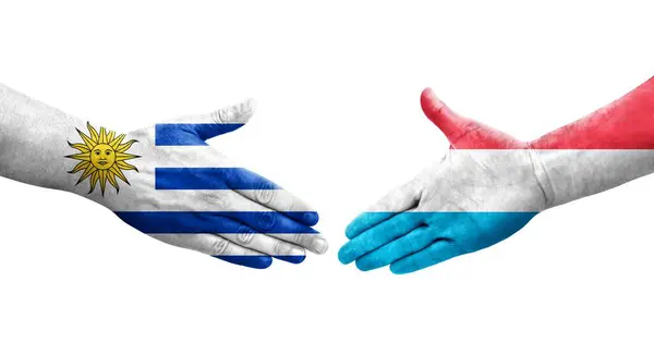 Χειραψία Μεταξύ Λουξεμβούργου Και Ουρουγουάης Σημαίες Ζωγραφισμένα Στα Χέρια Απομονωμένη — Φωτογραφία Αρχείου