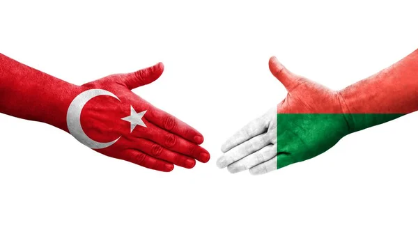 马达加斯加和土耳其的握手旗手绘 孤立透明的图像 — 图库照片