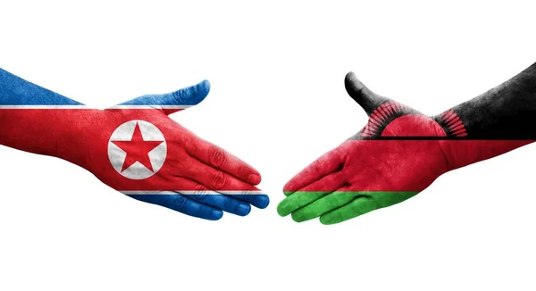 Aperto Mão Entre Malawi Bandeiras Coreia Norte Pintadas Mãos Imagem — Fotografia de Stock
