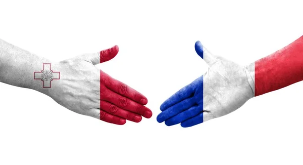 手に描かれたマルタとフランスの旗の間の握手 孤立した透明なイメージ — ストック写真