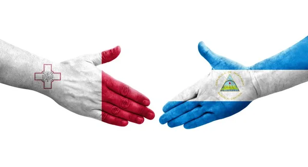 Handdruk Tussen Malta Nicaragua Vlaggen Geschilderd Handen Geïsoleerd Transparant Beeld — Stockfoto