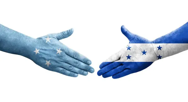 Aperto Mão Entre Micronésia Bandeiras Honduras Pintadas Mãos Imagem Transparente — Fotografia de Stock