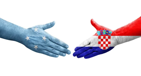 미크로네시아와 크로아티아의 국기가 손으로 고립된 이미지 — 스톡 사진