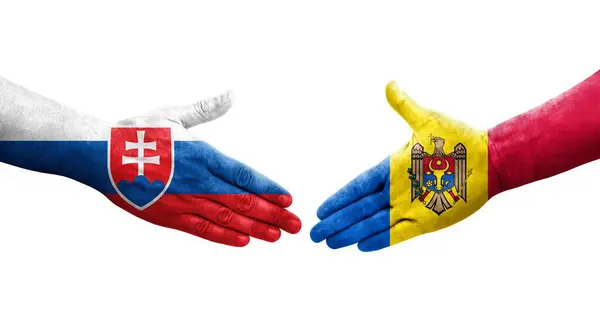 stock image Handshake between Moldova and Slovakia flags painted on hands, isolated transparent image.