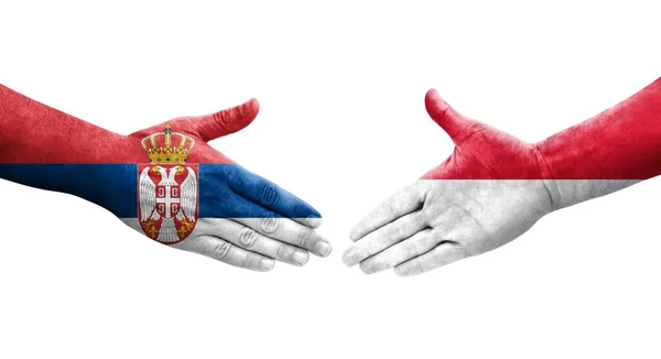 Aperto Mão Entre Mônaco Sérvia Bandeiras Pintadas Mãos Imagem Transparente — Fotografia de Stock