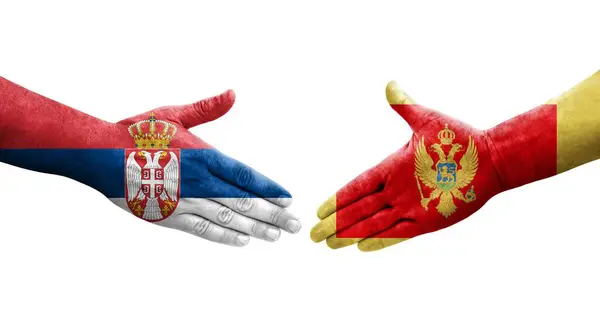 Händedruck Zwischen Den Flaggen Montenegros Und Serbiens Auf Hände Gemalt — Stockfoto