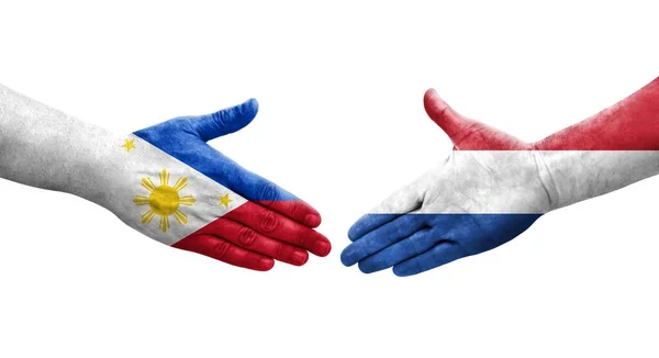 Uścisk Dłoni Między Holandią Filipinami Flagi Malowane Rękach Odizolowany Przezroczysty — Zdjęcie stockowe