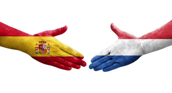 네덜란드와 스페인 손으로 깃발을 악수하는 고립된 이미지 — 스톡 사진