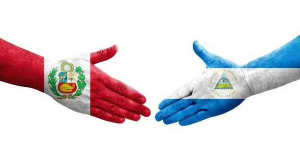 Χειραψία Μεταξύ Νικαράγουας Και Περού Σημαίες Ζωγραφισμένα Στα Χέρια Απομονωμένη — Φωτογραφία Αρχείου