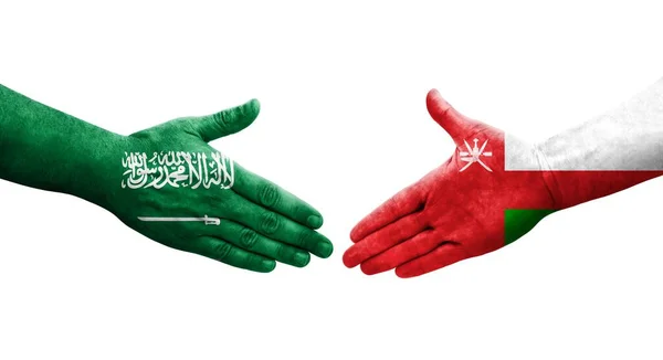 Handdruk Tussen Oman Saoedi Arabië Vlaggen Geschilderd Handen Geïsoleerd Transparant — Stockfoto