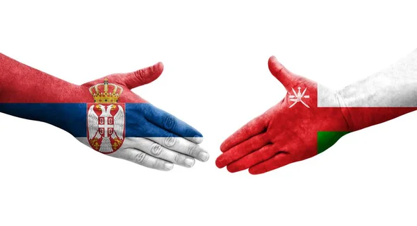 Χειραψία Μεταξύ Ομάν Και Σερβίας Σημαίες Ζωγραφισμένες Στα Χέρια Απομονωμένη — Φωτογραφία Αρχείου