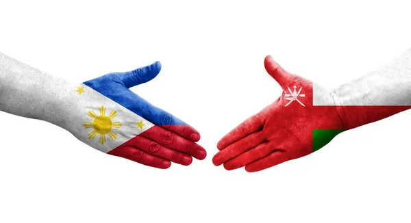 Uścisk Dłoni Między Flagami Omanu Filipin Namalowanymi Dłoniach Odizolowany Przezroczysty — Zdjęcie stockowe