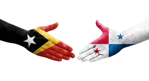 stock image Handshake between Panama and Timor Leste flags painted on hands, isolated transparent image.