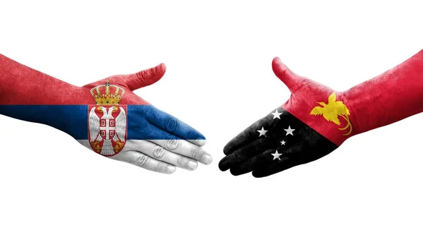 Apretón Manos Entre Papúa Nueva Guinea Serbia Banderas Pintadas Las —  Fotos de Stock