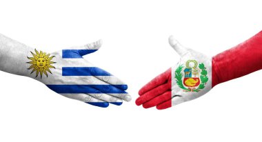 Peru ve Uruguay bayrakları arasındaki tokalaşma elleri boyalı, izole şeffaf görüntü.