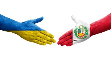 Peru ve Ukrayna bayrakları arasındaki el sıkışma, izole şeffaf görüntü.