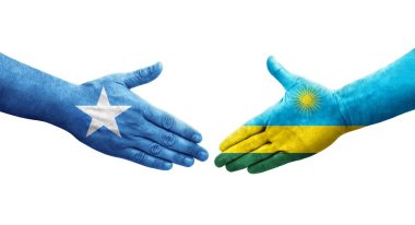 Ruanda ve Somali bayrakları arasındaki el sıkışma ellerinde resmedilmiş şeffaf görüntü.