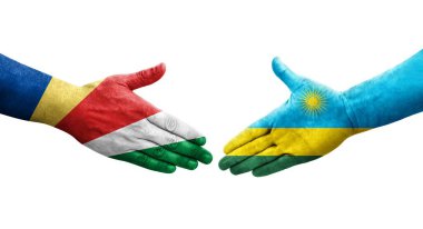 Ruanda ve Seyşeller arasındaki el sıkışma ellerinde boyanmış bayraklar, izole şeffaf görüntü.