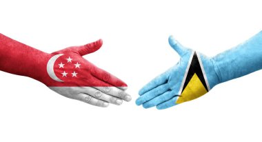 Saint Lucia ve Singapur bayrakları arasındaki el sıkışma ellere boyanmış, izole şeffaf görüntü.