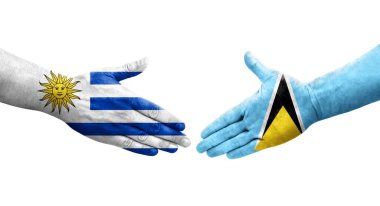 Saint Lucia ve Uruguay bayrakları arasındaki el sıkışma, izole şeffaf görüntü.