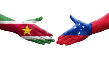 Samoa ve Surinam bayrakları arasındaki el sıkışma, izole şeffaf görüntü.