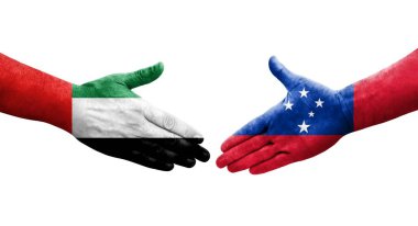 Samoa ve BAE bayrakları arasındaki tokalaşma elleri boyalı, izole şeffaf resim.