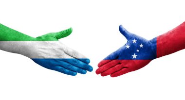 Samoa ve Sierra Leone bayrakları arasındaki el sıkışma ellerinde izole şeffaf görüntü.