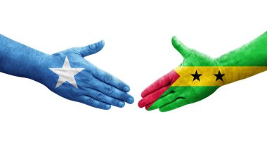 Sao Tome ve Principe arasındaki el sıkışma ve ellerinde Somali bayrakları, izole şeffaf görüntü.